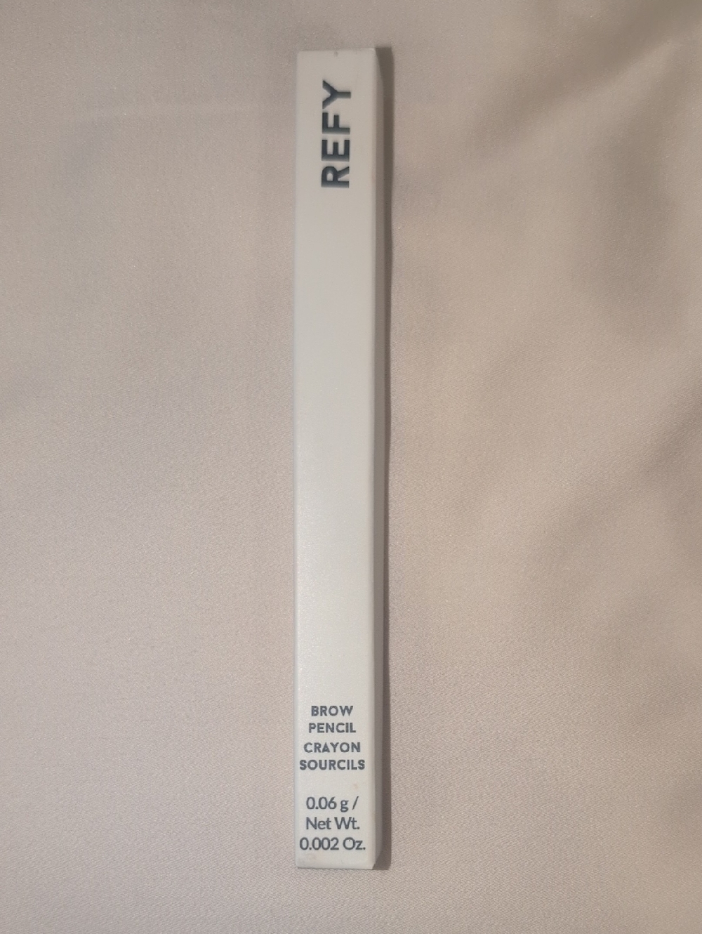 REFY Brow Pencil Packaging in White with Navy Text
